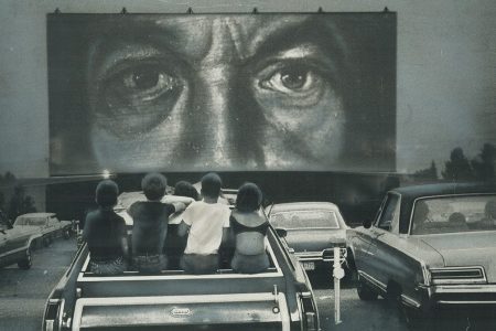 CANADA - JULY 25:  A Night out at the drive-in. These children watch from station wagon as parents take in a drive-in movie. Drive-ins are attracting family audiences; some operators say; and are losing the passion pit reputation. Those eyes back at the youngsters belong to someone in the first of a twin horror movie bill.   (Photo by Doug Griffin/Toronto Star via Getty Images)