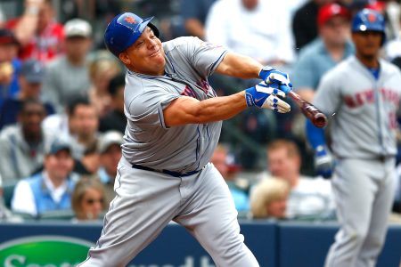 Bartolo Colon #40 of the New York Mets hits a RBI single into right field against the Atlanta Braves during the Braves opening series at Turner Field on April 12, 2015 in Atlanta, Georgia.  Wilmer Flores #4 scored on the single.  (Kevin C. Cox/Getty Images)