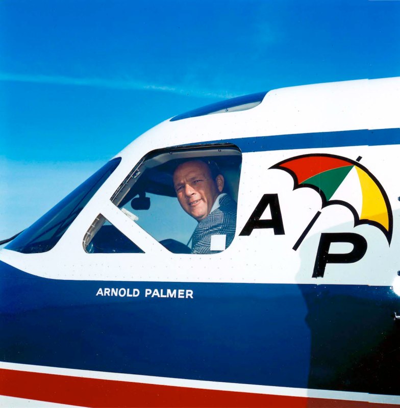Arnold Palmer peers out the window of his personal airplane around 1965 in Latrobe, Pennsylvania. (Photo by Transcendental Graphics/Getty Images)