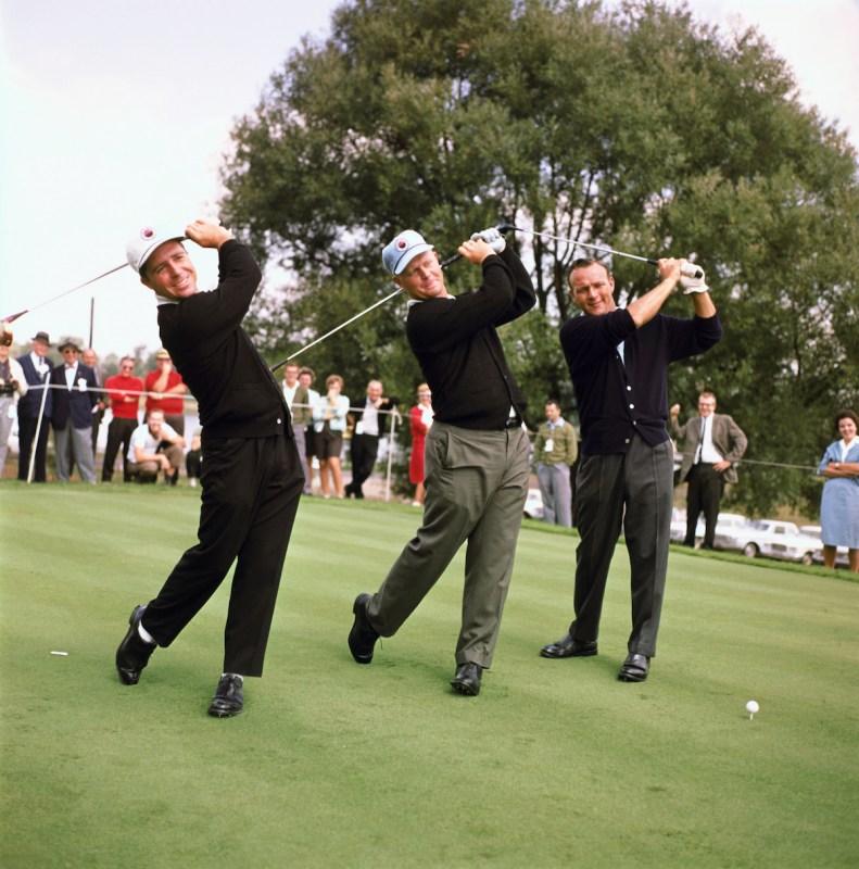 (Original Caption) Arkon, O.: Firestone Country Club, big three golfers in the world series of golf. Arnold Palmer, hatless, Jack Nicklaus (center) and Gary Player swing their clubs before a practice round.