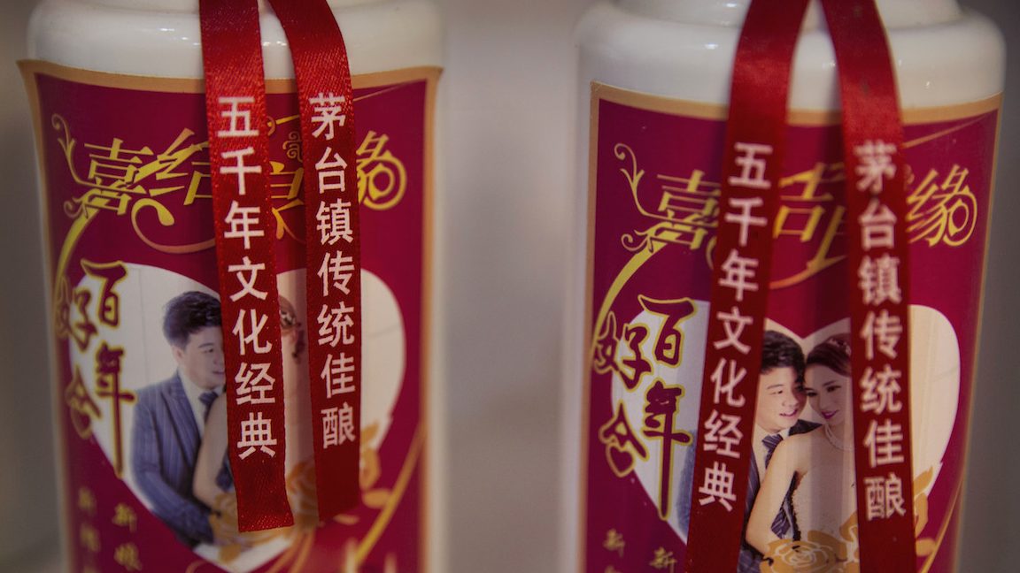 MAOTAI, CHINA - SEPTEMBER 22:  Bottles of locally made wine called baijiu are seen at a shop on the Chishui River on September 22, 2016 in Maotai,Guizhou province, China. Distillers in the famous Maotai town along the Chishui River produce well over half of the country's baijiu, the potent traditional Chinese wine made with fermented sorghum that is popular at state functions and often sells for hundreds of dollars per bottle. The most famous wine brands have long used the Chishui as their prime water source, giving the 437-kilometer long mainstream of the river a treasured reputation as being the "River of Wines". That the area is also revered as the site of a 1935 revolutionary battle led by Mao Zedong during the historic Long March of the Red Army has fortified efforts to protect the ecology of the Chishui and the river basin. This year, governments in the three provinces that the river crosses imposed strict measures to curb sewage disposal, over-development, and environmental degradation. As a result, the Chishui, which literally means "red water river' due to its reddish sentiment, is the only branch of the upper Yangtze that is not polluted, has no dams or reservoirs on its mainstream, and will eventually have a full ban on fishing. Authorities also closed nearly five hundred distilleries and paper mills. Major distillers dependent on the health of the "River of Wines" pay millions of dollars per year toward environmental maintenance and enforcement. (Photo by Kevin Frayer/Getty Images)
