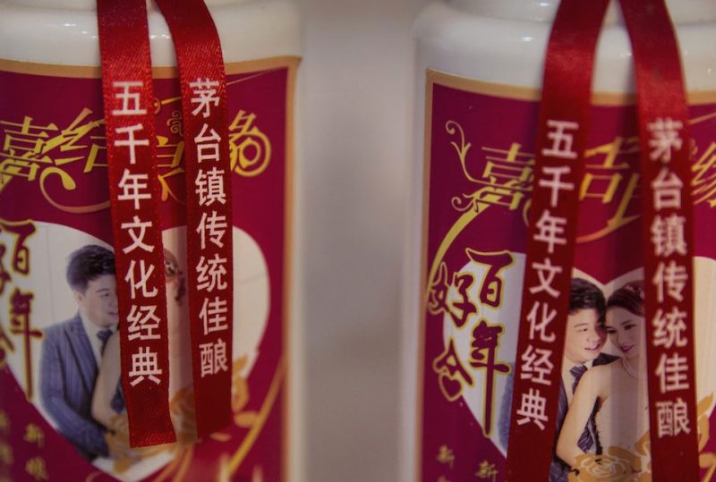 MAOTAI, CHINA - SEPTEMBER 22: Bottles of locally made wine called baijiu are seen at a shop on the Chishui River on September 22, 2016 in Maotai,Guizhou province, China. Distillers in the famous Maotai town along the Chishui River produce well over half of the country's baijiu, the potent traditional Chinese wine made with fermented sorghum that is popular at state functions and often sells for hundreds of dollars per bottle. The most famous wine brands have long used the Chishui as their prime water source, giving the 437-kilometer long mainstream of the river a treasured reputation as being the "River of Wines". That the area is also revered as the site of a 1935 revolutionary battle led by Mao Zedong during the historic Long March of the Red Army has fortified efforts to protect the ecology of the Chishui and the river basin. This year, governments in the three provinces that the river crosses imposed strict measures to curb sewage disposal, over-development, and environmental degradation. As a result, the Chishui, which literally means "red water river' due to its reddish sentiment, is the only branch of the upper Yangtze that is not polluted, has no dams or reservoirs on its mainstream, and will eventually have a full ban on fishing. Authorities also closed nearly five hundred distilleries and paper mills. Major distillers dependent on the health of the "River of Wines" pay millions of dollars per year toward environmental maintenance and enforcement. (Photo by Kevin Frayer/Getty Images)