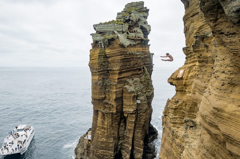 Gary Hunt, of the UK dives from 27 metres off the cliff at Islet Franca do Campo prior to third stop of the Red Bull Cliff Diving World Series, Sao Miguel, Azores, Portugal on July 8th 2016. (Paulo Calisto/Red Bull Content Pool)
