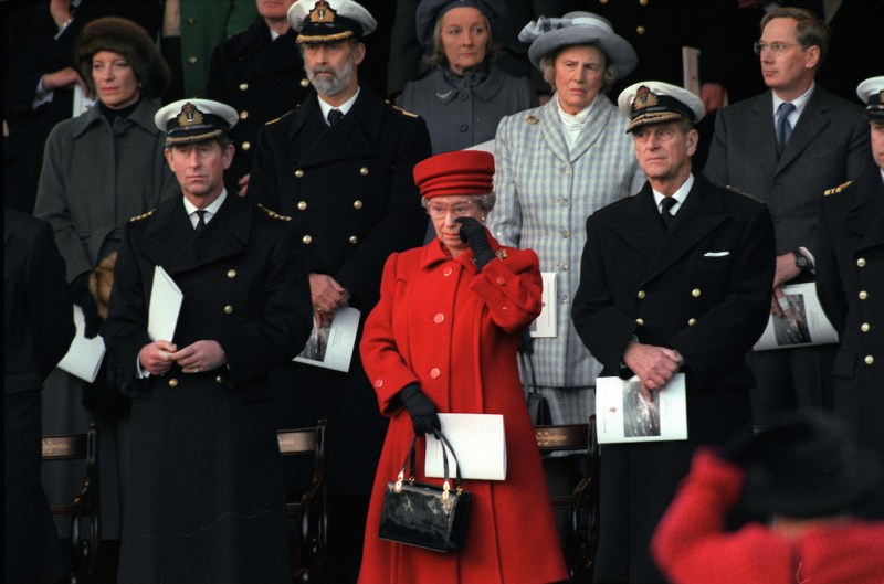 PORTSMOUTH, UNITED KINGDOM - DECEMBER 11: The Queen Wiping A Tear From Her Eye At The De-commissioning Ceremony For Hmy Britannia. With Her Are Prince Philip And Prince Charles And Behind Her Her Lady In Waiting The Duchess Of Grafton (Photo by Tim Graham/Getty Images)