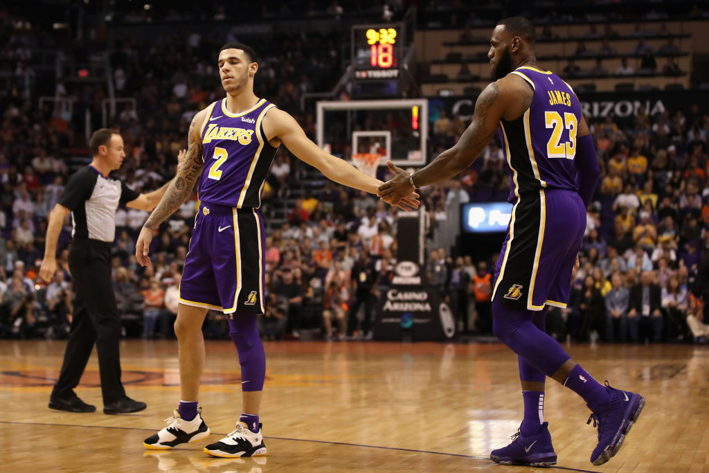 PHOENIX, AZ - OCTOBER 24:  Lonzo Ball #2 and LeBron James #23 of the Los Angeles Lakers high five during the first half of the NBA game against the Phoenix Suns at Talking Stick Resort Arena on October 24, 2018 in Phoenix, Arizona. (Photo by Christian Petersen/Getty Images)