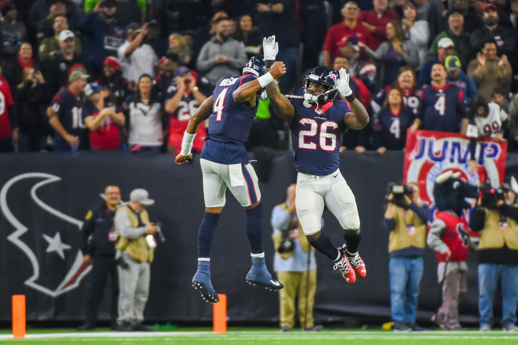 Houston Texans Quarterback Deshaun Watson (4) celebrates with Houston Texans Running Back Lamar Miller (26) following Miller's 97-yard rushing touchdown during the football game between the Tennessee Titans and Houston Texans on November 26, 2018 at NRG Stadium in Houston, Texas. (Photo by Ken Murray/Icon Sportswire via Getty Images)