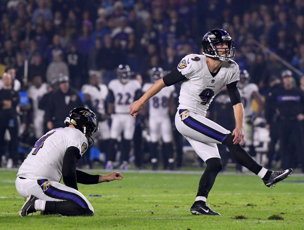 CARSON, CALIFORNIA - DECEMBER 22:   Justin Tucker #9 of the Baltimore Ravens watches his field goal with Sam Koch #4, to take a 3-0 lead over the Los Angeles Chargers, during the first quarter at StubHub Center on December 22, 2018 in Carson, California. (Photo by Harry How/Getty Images)