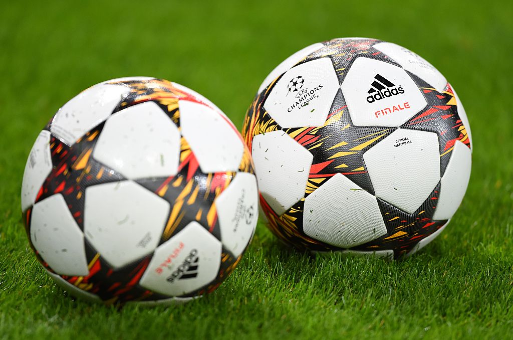 Adidas official match balls sit on the pitch prior to a UEFA Champions League group stage football match Anderlecht vs Arsenal at the Constant Vanden Stock stadium in Anderlecht on October 22, 2014.
 AFP PHOTO / EMMANUEL DUNAND        (Photo credit should read EMMANUEL DUNAND/AFP/Getty Images)