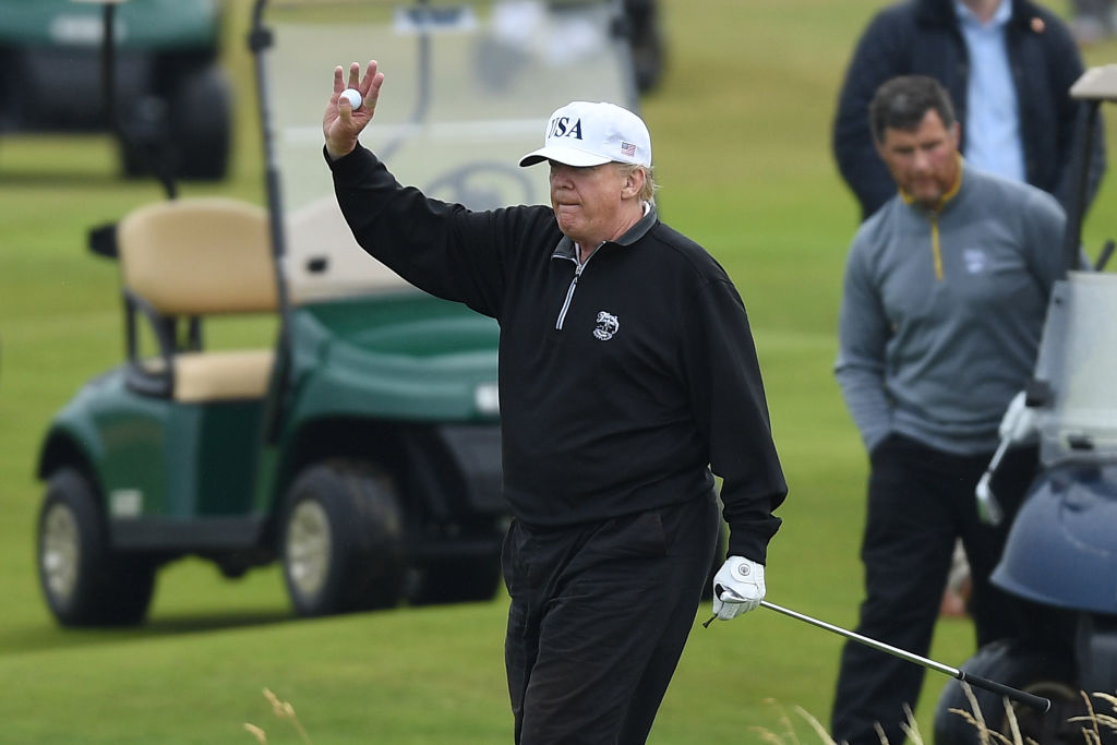 U.S. President Donald Trump playing golf. (Photo by Leon Neal/Getty Images)