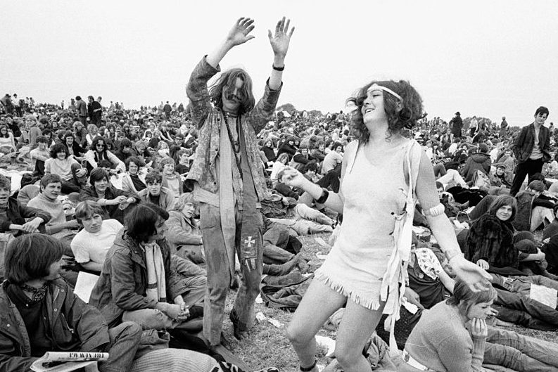 Hippies dancing at The Isle of Wight Festival in 1969. (Daily Mirror/Mirrorpix via Getty)