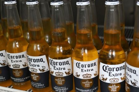 Picture of bottles of Mexican beer Corona, taken in Mexico City on June 4, 2019. (Photo by Rodrigo ARANGUA / AFP)        