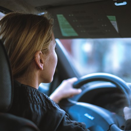 Young woman driving a car