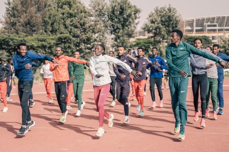 A group of Olympic runners warming up before a run.