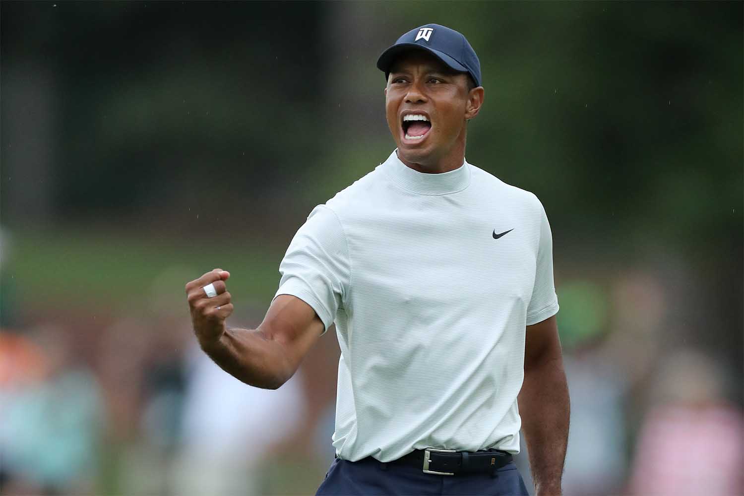 Tiger Woods of the United States celebrates after making a putt for birdie on the 15th green during the second round of the Masters at Augusta National Golf Club on April 12, 2019 in Augusta, Georgia.