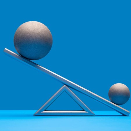 With little evidence, some people believe a certain probiotic can increase testicle size.Pictured: One large and one smaller silver ball on seesaw weight scale, larger ball on high side, blue surface and background