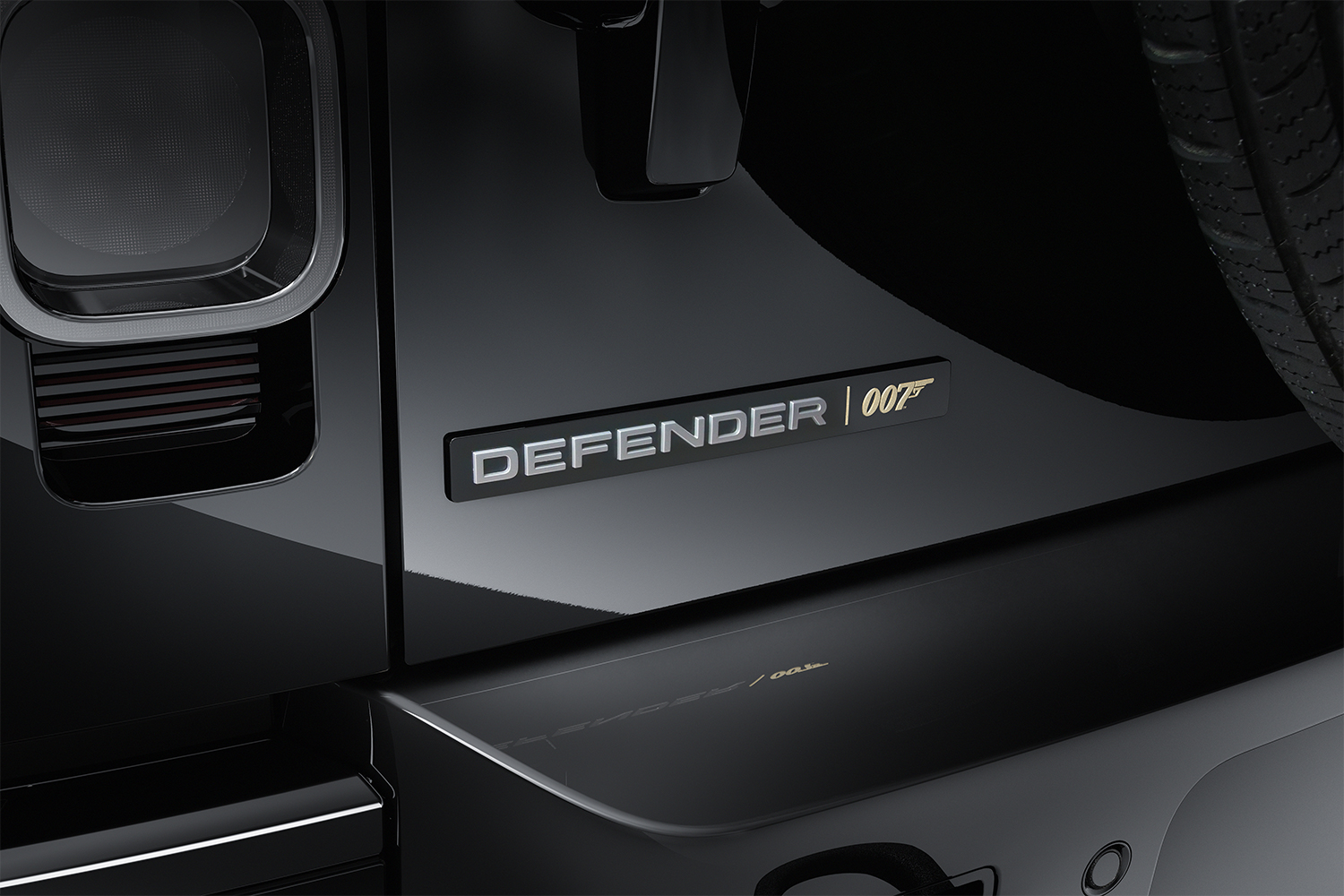 The Defender and James Bond 007 logo on the back of an all-black Land Rover Defender V8 SUV inspired by 