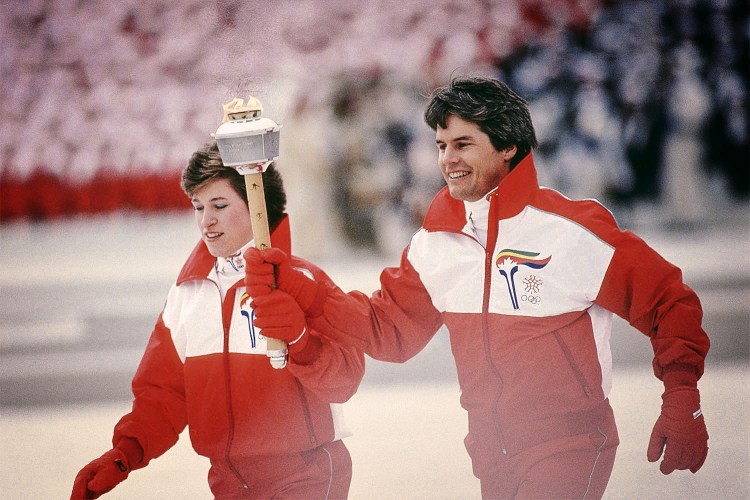 Canadian Olympic Athletes Celebrate in Retro Inspired Red Podium