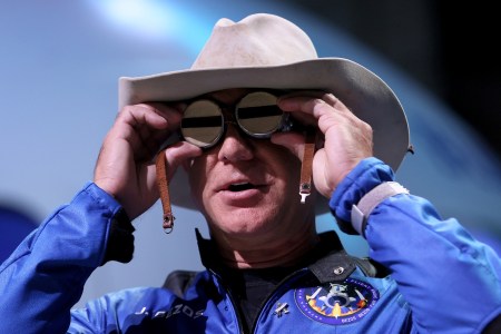 Jeff Bezos holds the aviation glasses that belonged to Amelia Earhart as he speaks during a press conference about his flight on Blue Origin’s New Shepard into space on July 20, 2021 in Van Horn, Texas.