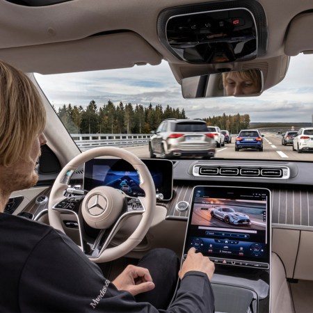 A driver using the Mercedes-Benz Drive Pilot system, driver-assistance tech that has achieved SAE Level 3 autonomy. Here's why it's better than Tesla's Autopilot and Full Self-Driving.