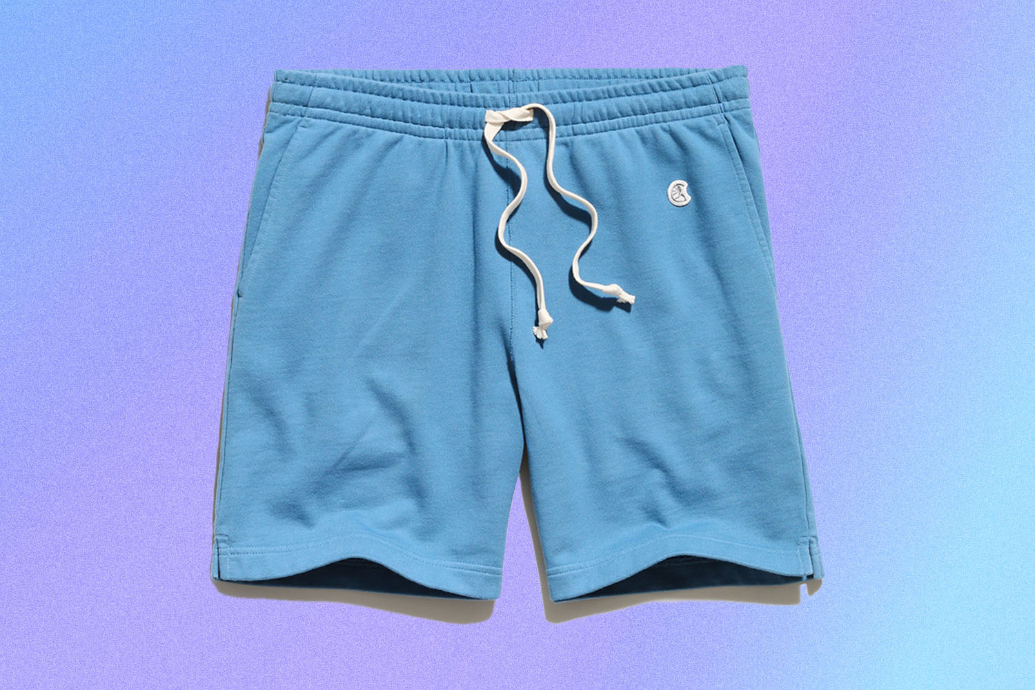 a pair of blue Todd Snyder shorts on a blue background