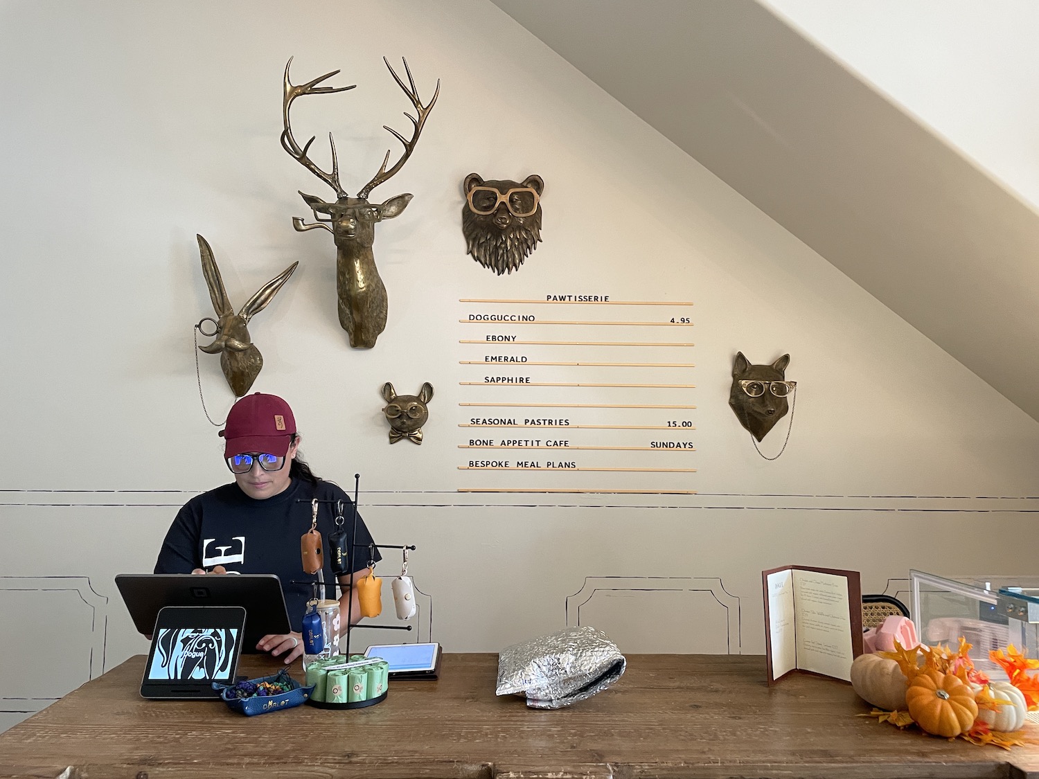 Alejandra of Dogue works the Pawtisserie counter with treats for dogs