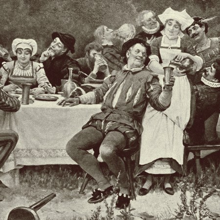 an old timey feast in black and white with lots of wine being poured