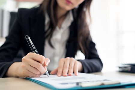 Businesswoman signing contract