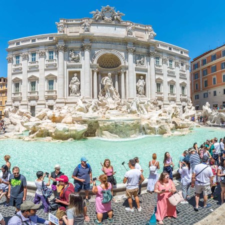The Trevi Fountain surrounded by tourists