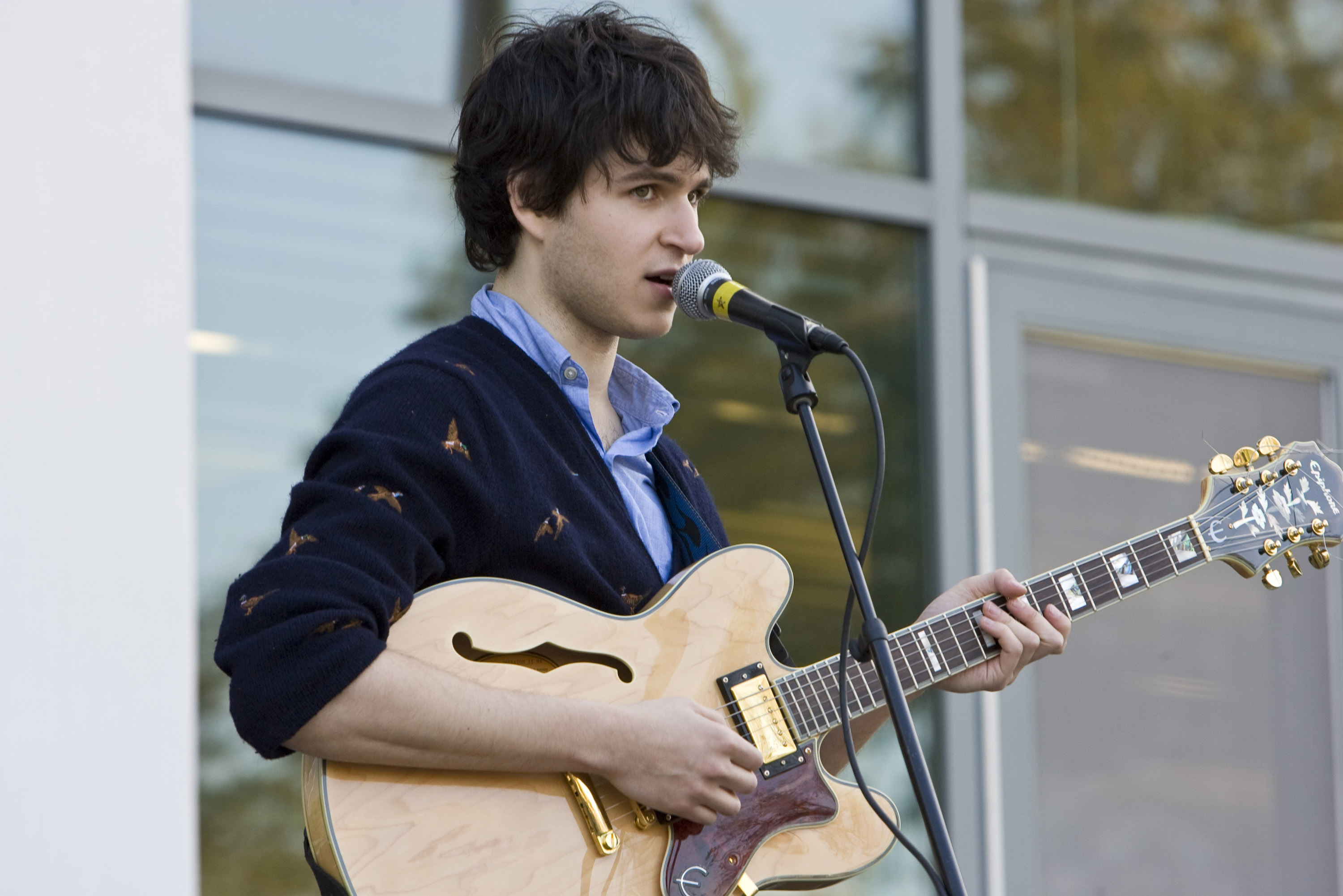 a photo of Ezra Koenig from Vampire Weekend in an OCBD