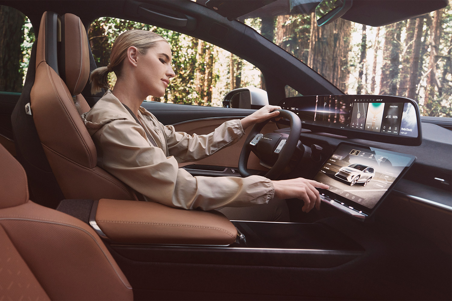 A woman driving an electric SUV from Lucid