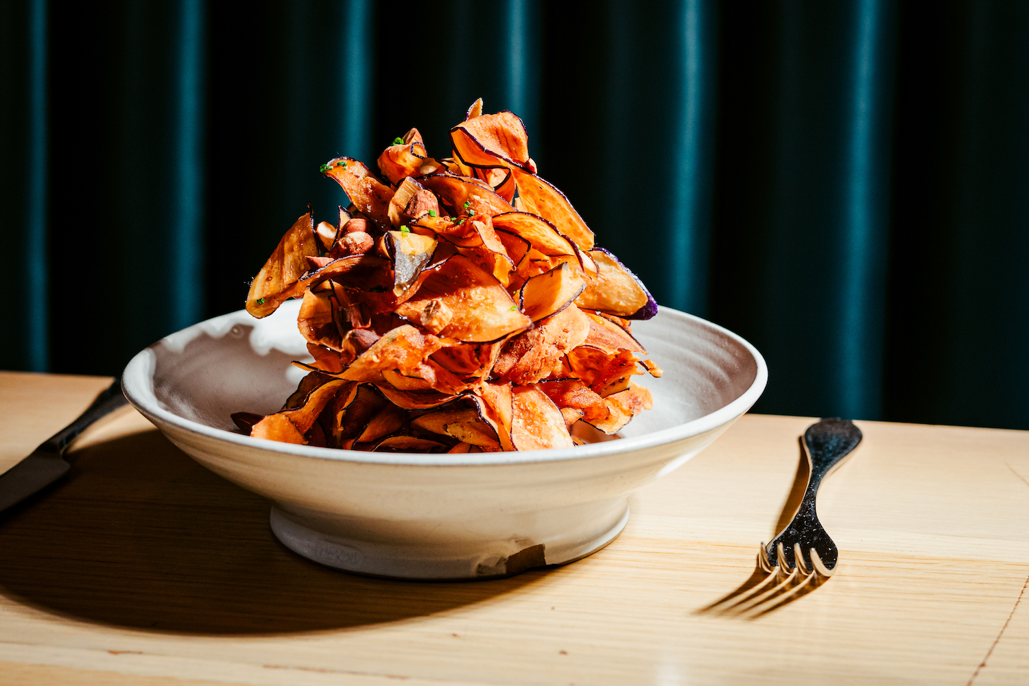 Centrolina's melanzane, with crispy fried eggplant topped with toasted almonds, honey and chive