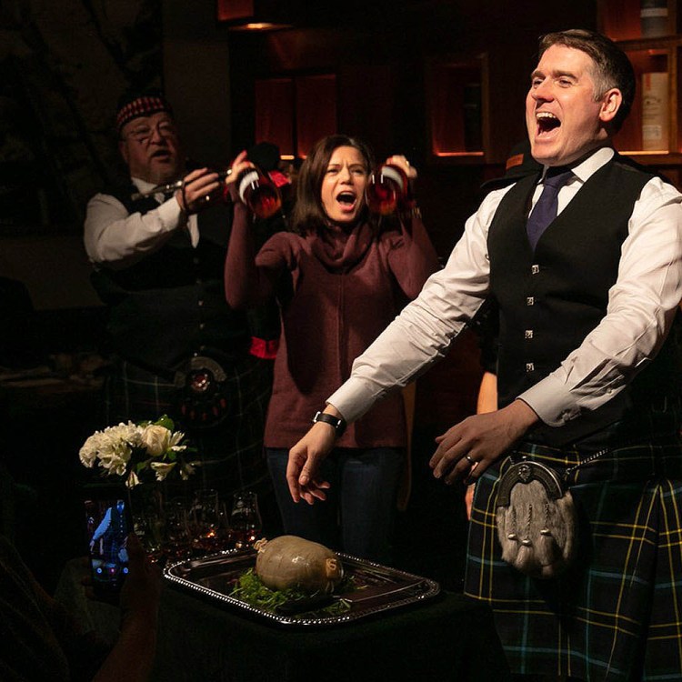 Andrew Weir (right) celebrating Burns Night with haggis