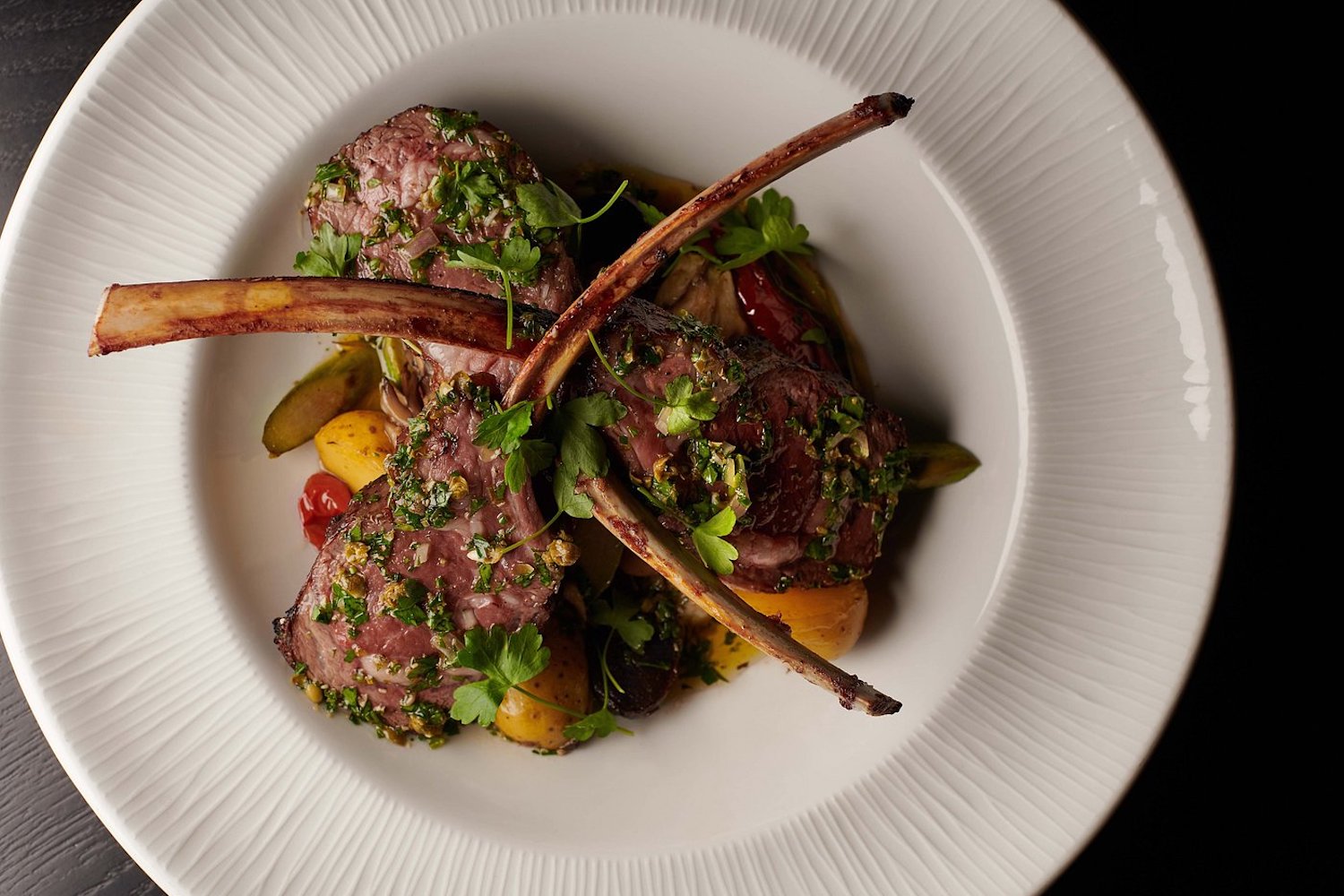 BLVD Steakhouse's tomahawk steak, including potatoes and cilantro