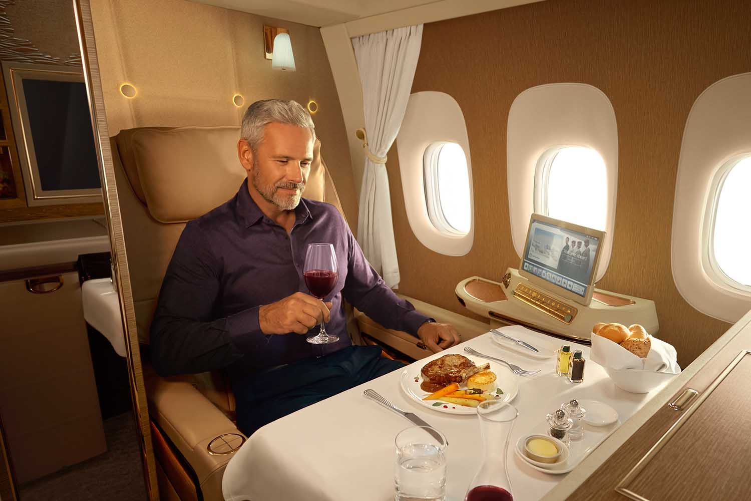 A man drinking good wine on Emirates