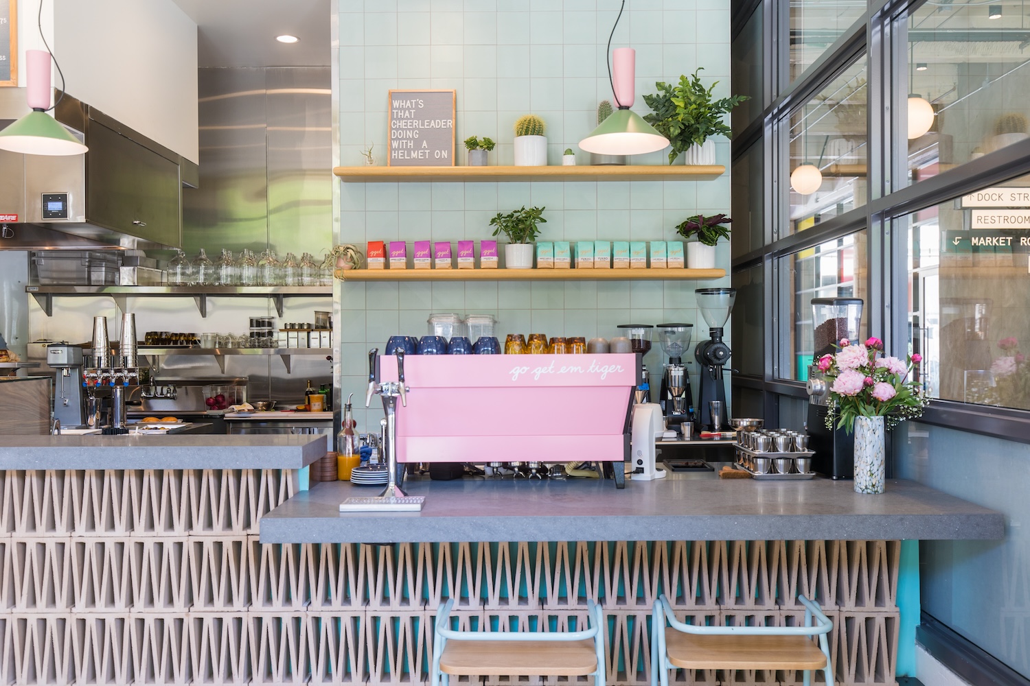 pink lamps, pink flowers, pink bags of coffee, counter