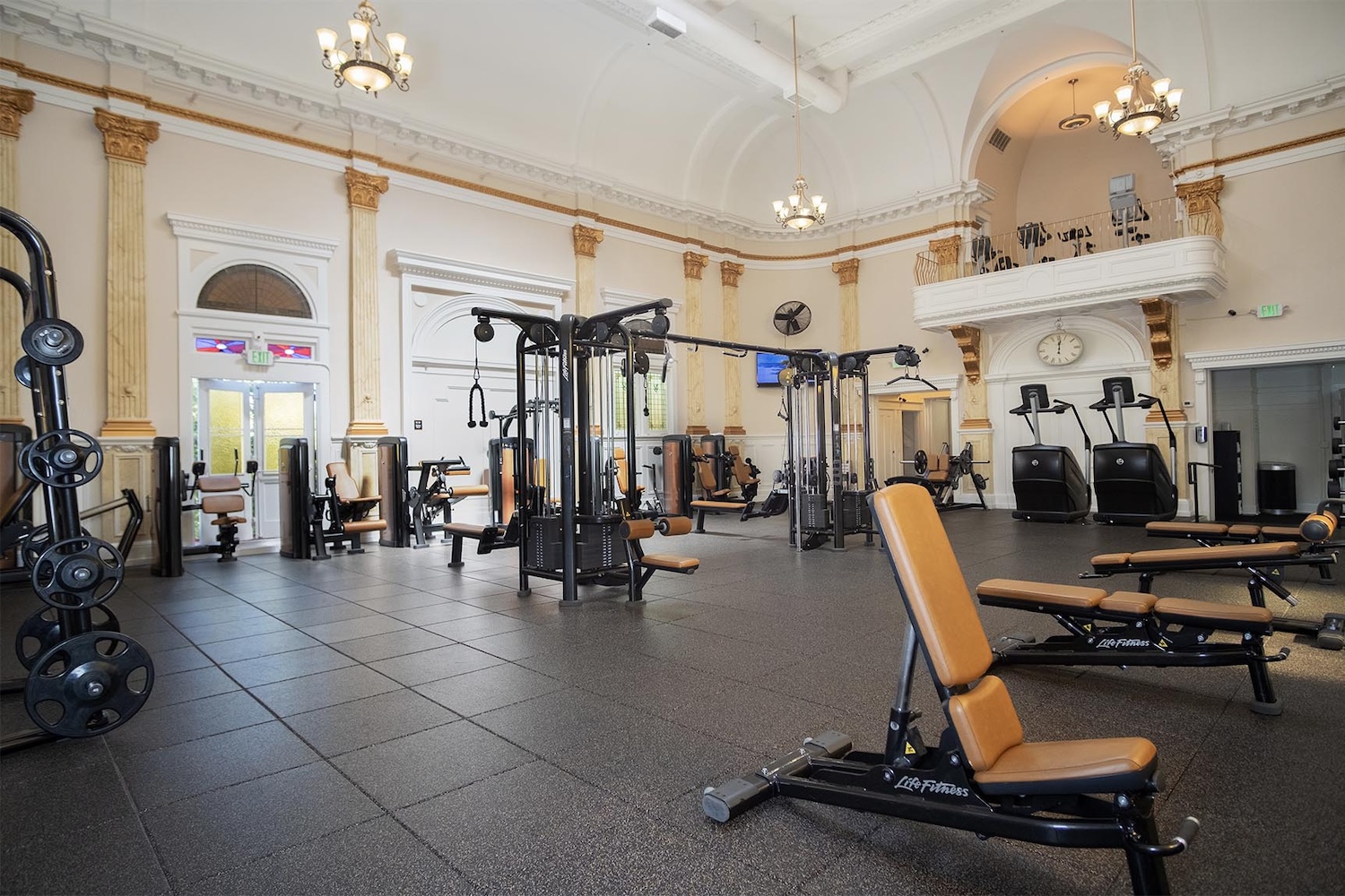 gym equipment, lamps hanging, terraces, columns, and old architecture 