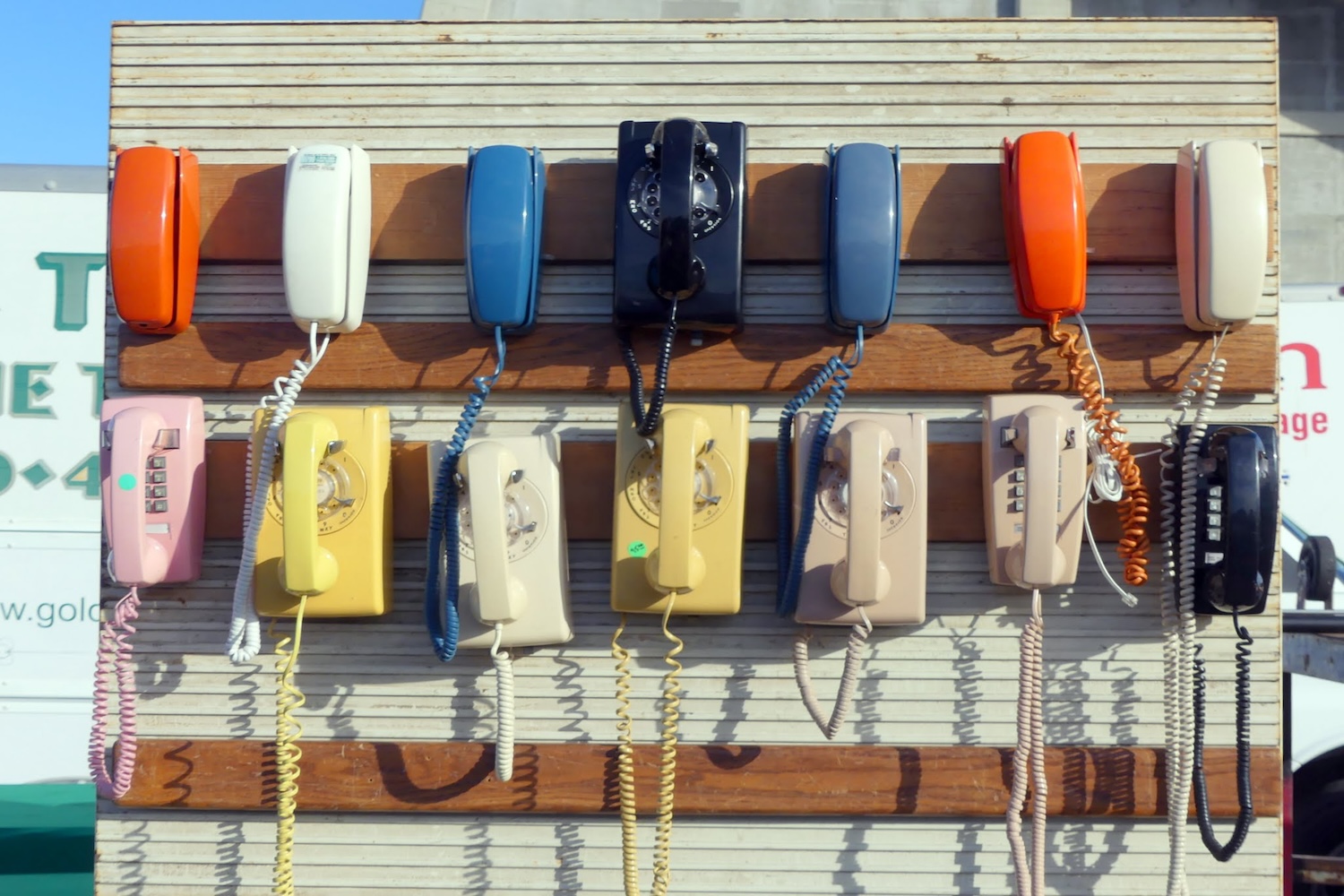 multicolored vintage telephones
