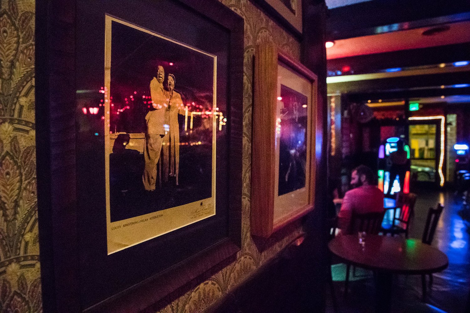 Close-up of picture frames along the wall inside of Club Waziema.