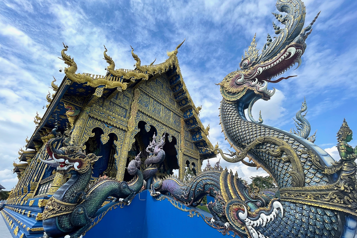 The striking exteriors of the blue temple at Chiang Rai