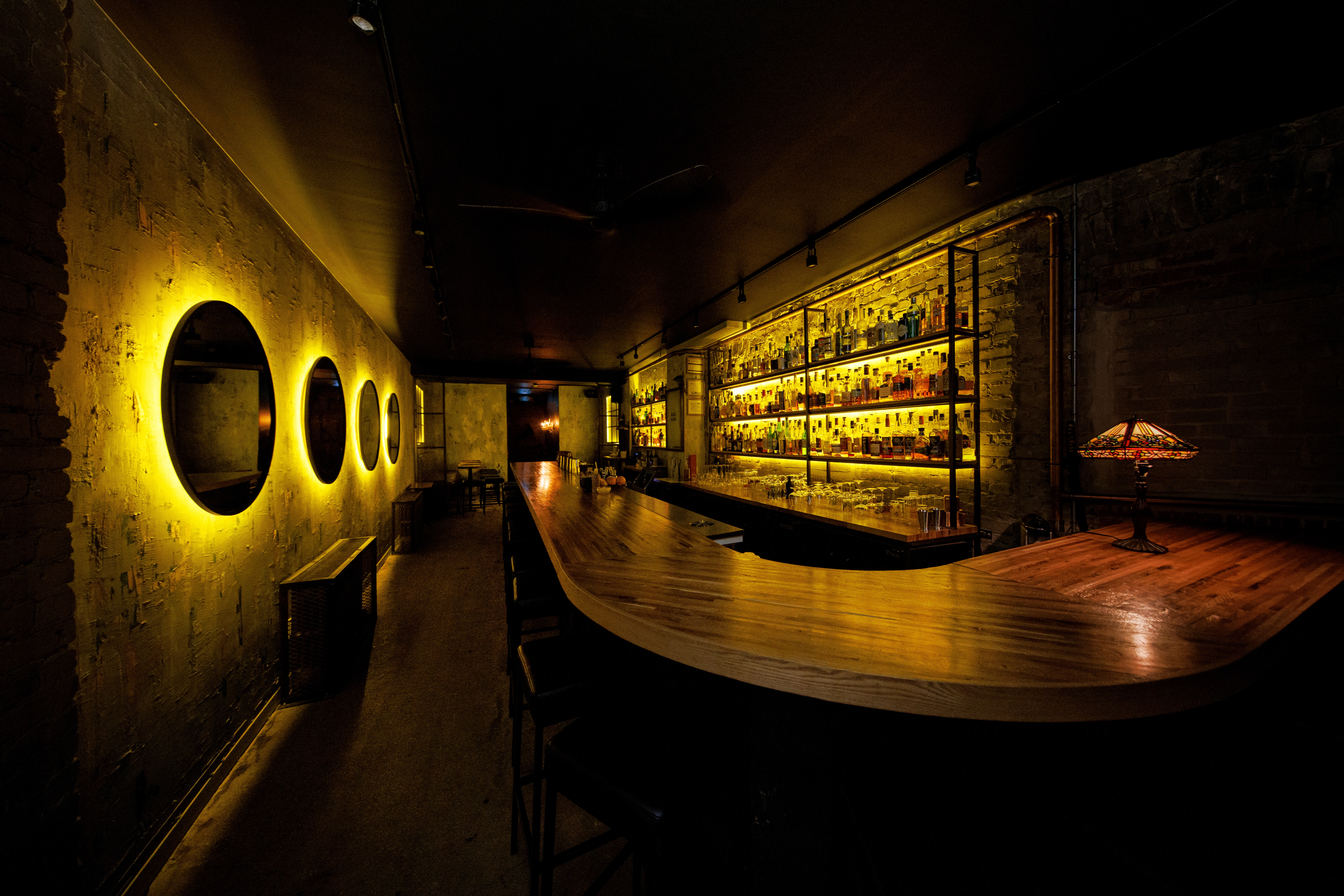 Hidden behind a functioning art gallery, Cry Baby Gallery is a speakeasy-style bar with an industrial vibe.