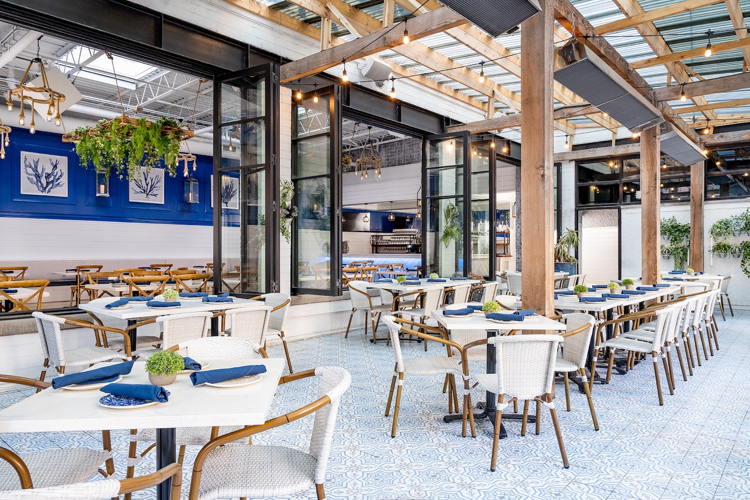 The Hampton Social features two patios - an indoor-outdoor space framed by sliding doors, and an elegant rooftop lounge