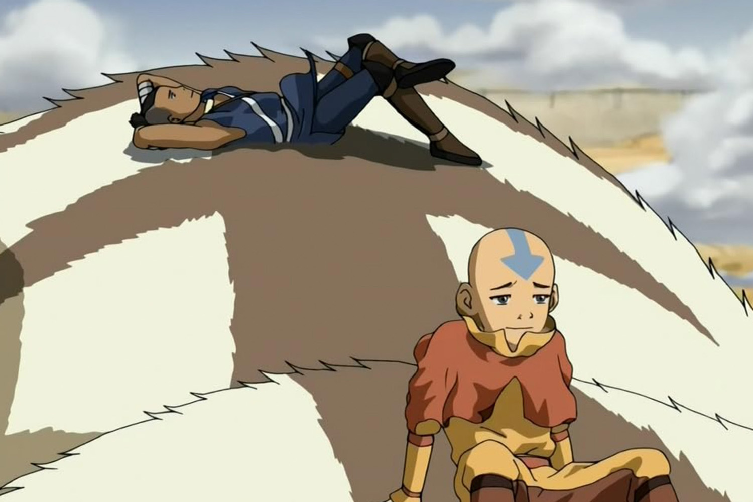 A shot from "Avatar: The Last Airbender," featuring Aang and Sokka resting on the flying bison, Appa.