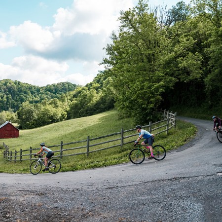 A photo of bikers rounding a farmland corner in Tennessee, which is trying to become America's next cycling paradise