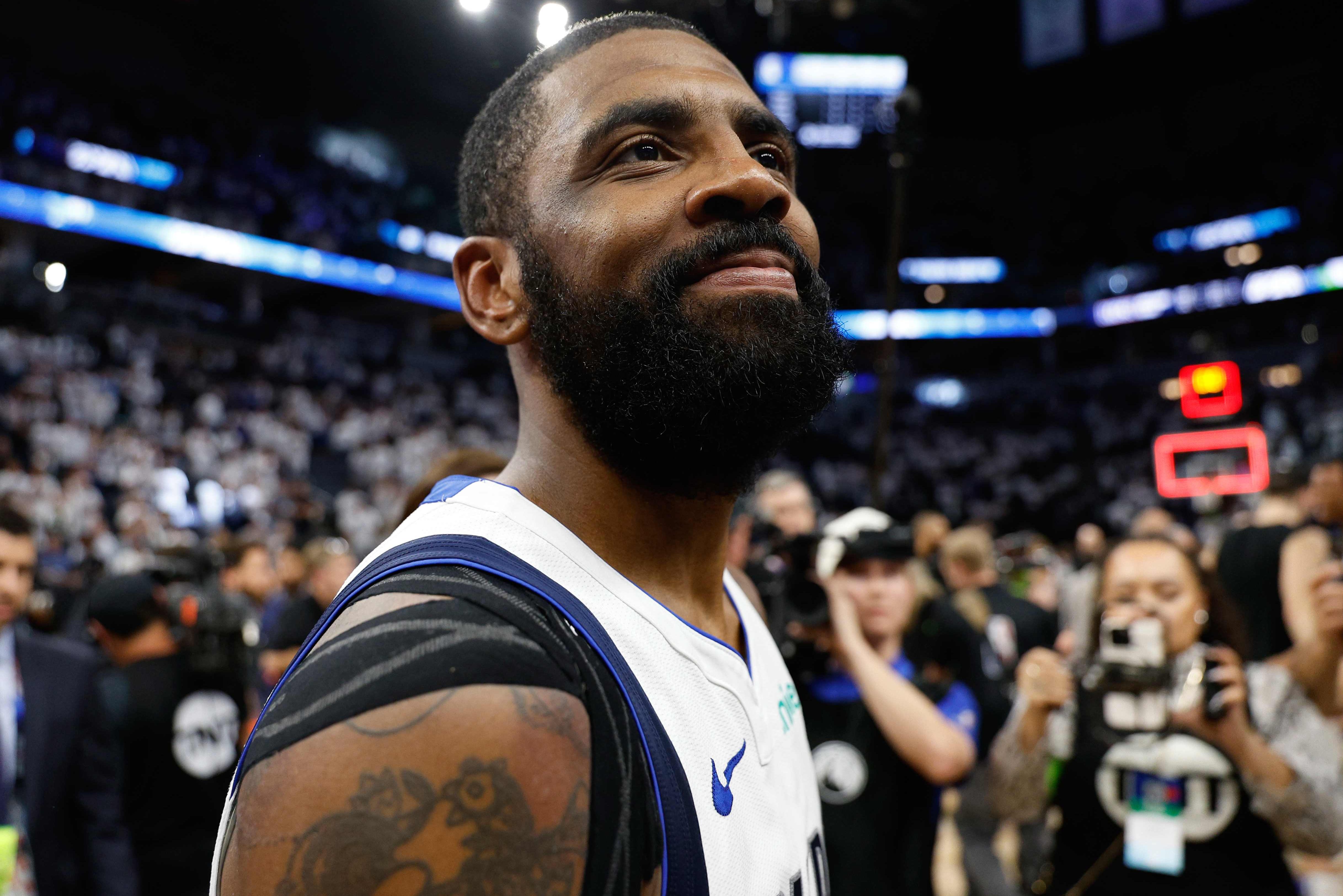 Kyrie Irving celebrates after a victory against the Minnesota Timberwolves.