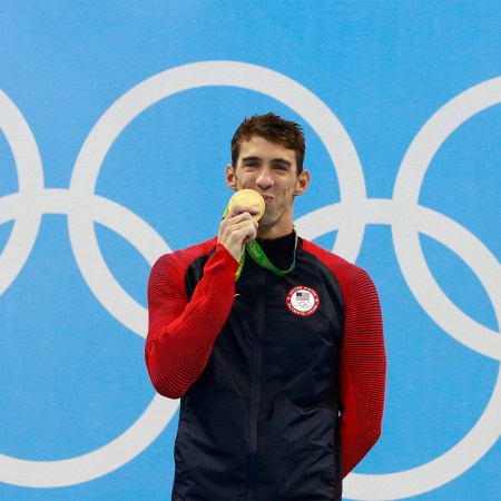 Michael Phelps kissing an Olympic gold medal. Would the record-breaking swimmer even medal in today's Olympics?