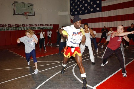 Billy Blanks filming a Tae Bo workout class in the early 2000s. How does the exercise program hold up in the 2020s?