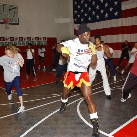 Billy Blanks filming a Tae Bo workout class in the early 2000s. How does the exercise program hold up in the 2020s?