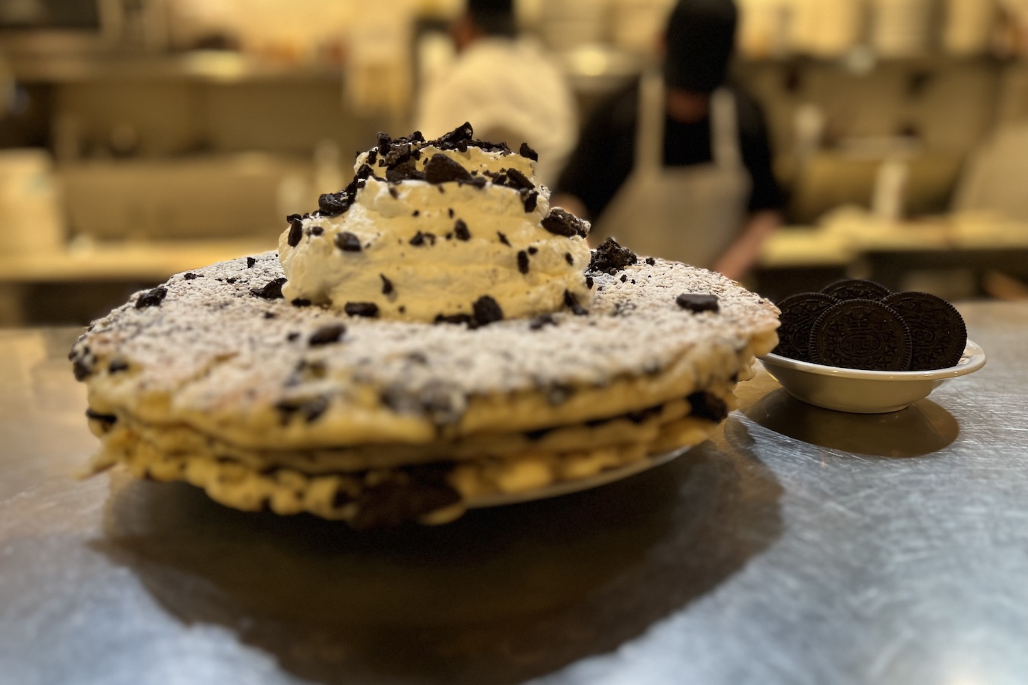 Griddle Cafe's Black Magic pancakes are stuffed with crushed Oreos, then topped with whipped cream and more Oreos