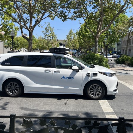 An autonomous vehicle using tech from Aurora Innovation driving along University Avenue in Palo Alto, California.