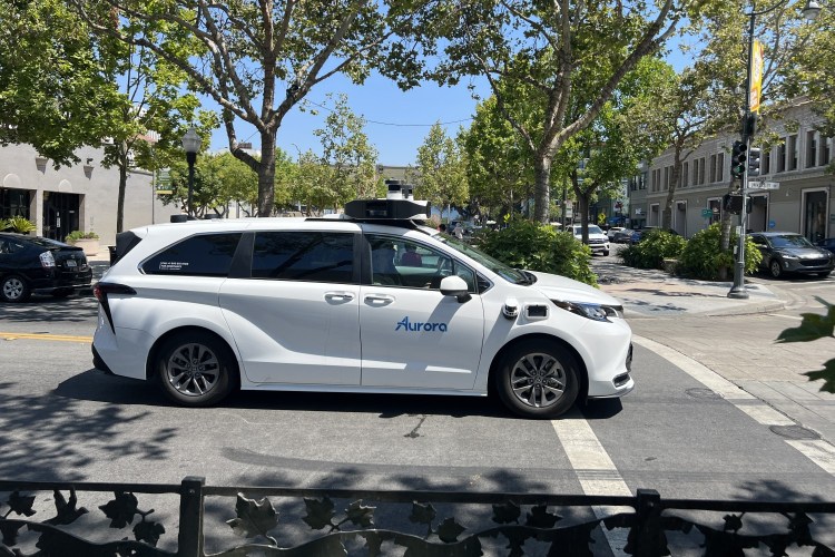 An autonomous vehicle using tech from Aurora Innovation driving along University Avenue in Palo Alto, California.
